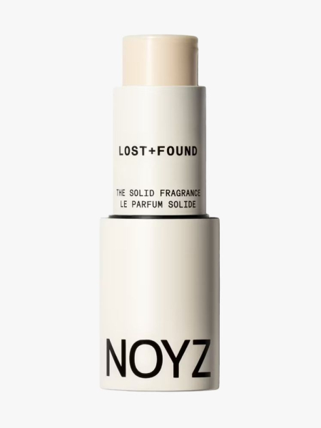 Noyz The Solid Perfume in branded component on a light gray background